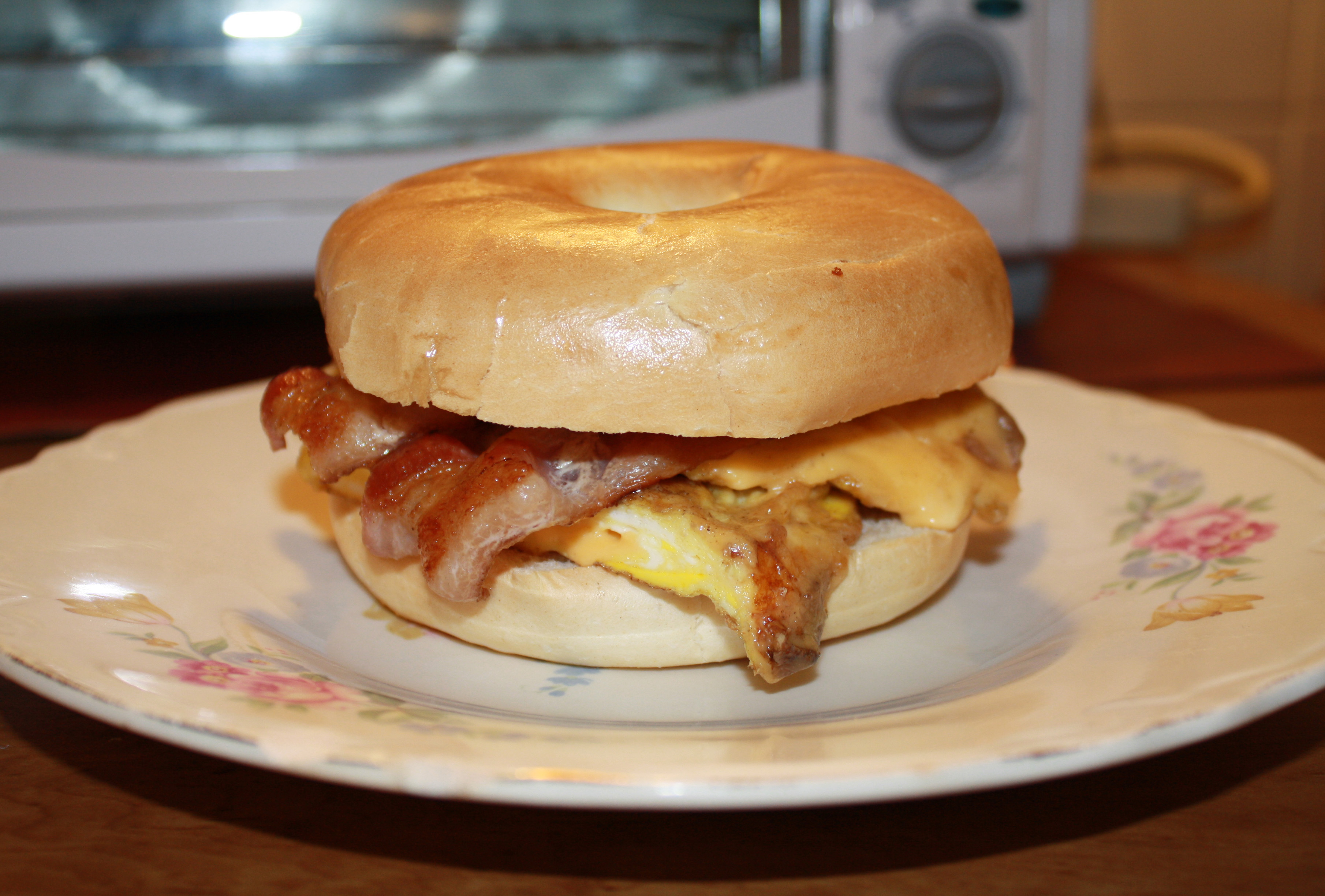 Cheese Omelet and Bacon on plain bagel – Sandwich Portraits